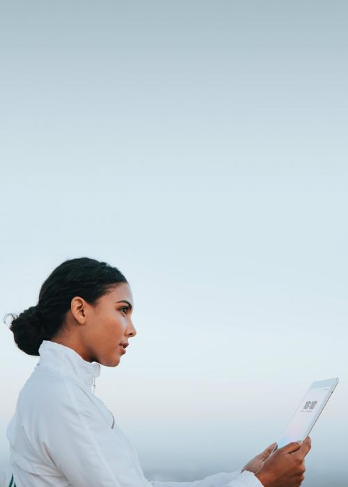 Woman looking at her digital tablet - 2024933