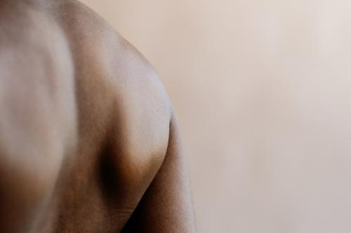 Rear view of a flexed back muscular - 2025369