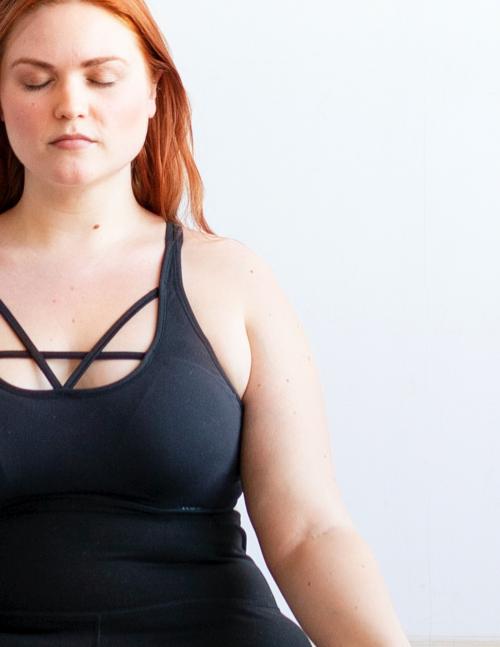 Woman doing meditation in yoga class - 2048871