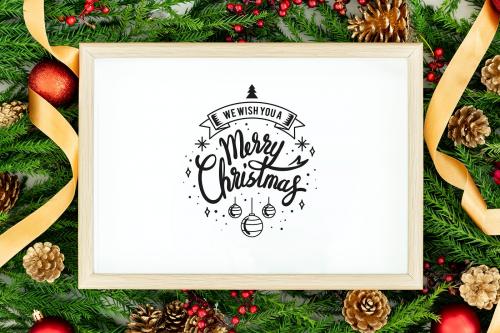 Merry Christmas greeting in a frame mockup - 520126