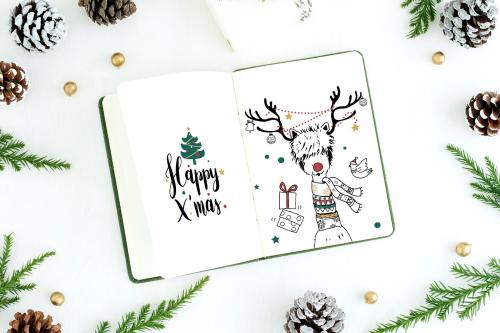 Christmas illustrations in a notebook mockup - 520177