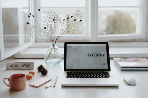 Laptop on a table with a coffee mug - 521344