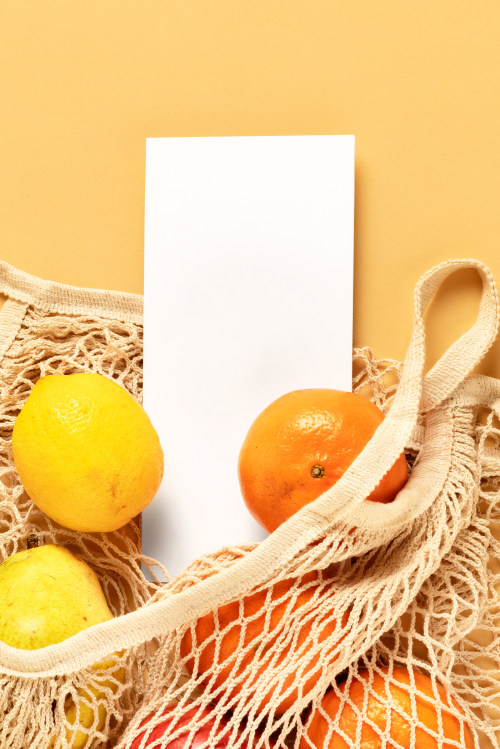 Flyer mockup in a reusable net bag with fruits transparent png - 2276531