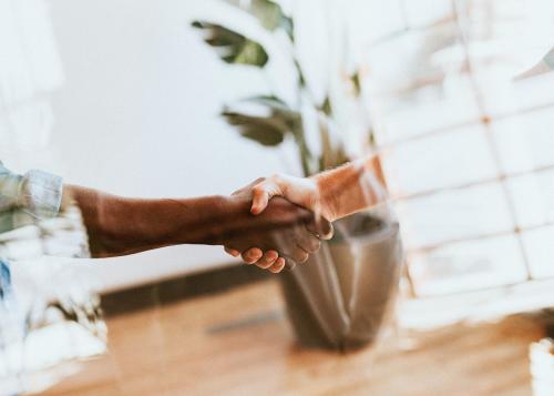 People shaking hands in a meeting - 2052675