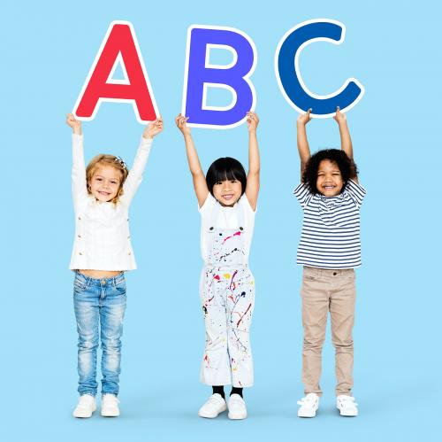 Diverse happy kids learning the ABC - 504431