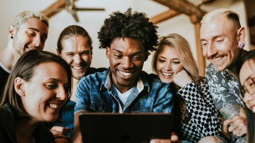 Diverse people using a digital tablet together - 2206333