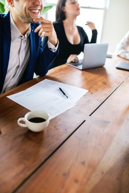 Smiling businessman in a meeting - 2203515