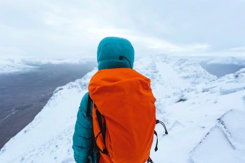 Mountaineers climbing a snowy Liathach Ridge in Scotland - 2221636