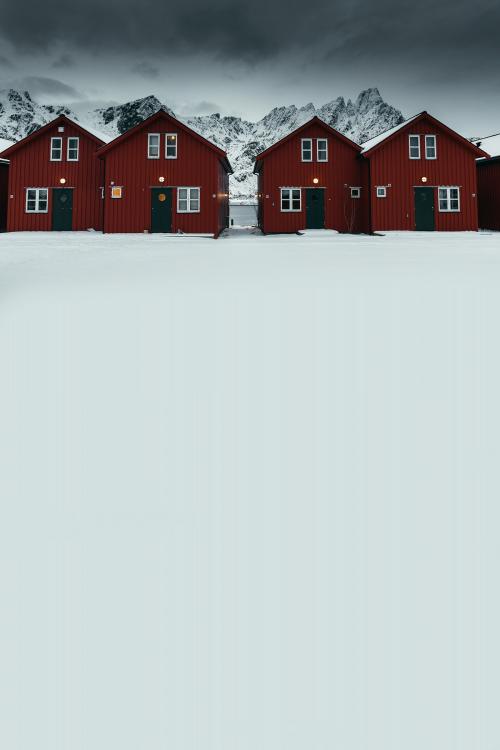 Row of red cabins on a snowy coast of Sakrisoy island, Norway - 2256922