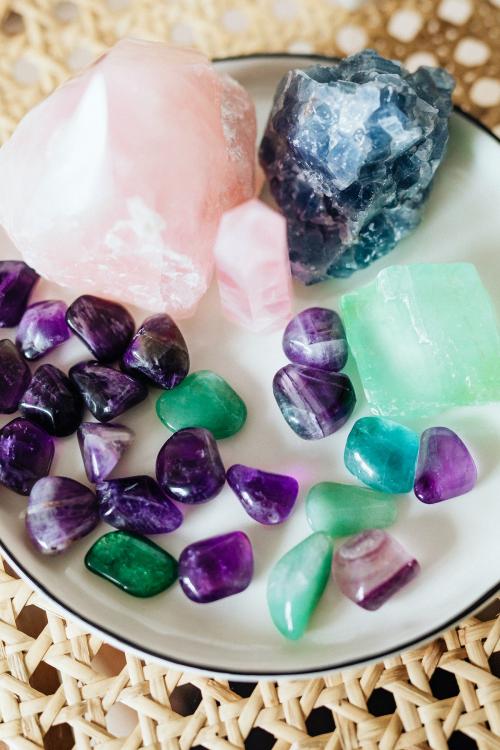 Colorful healing crystals on a ceramic plate - 2281985