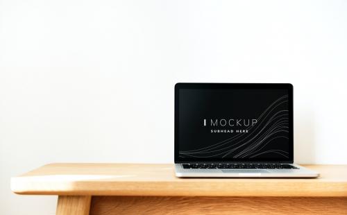 Laptop screen mockup on a wooden table - 502907