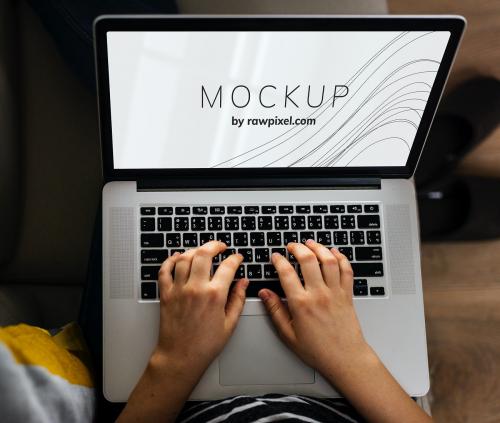 Woman using a laptop with a screen mockup - 502933