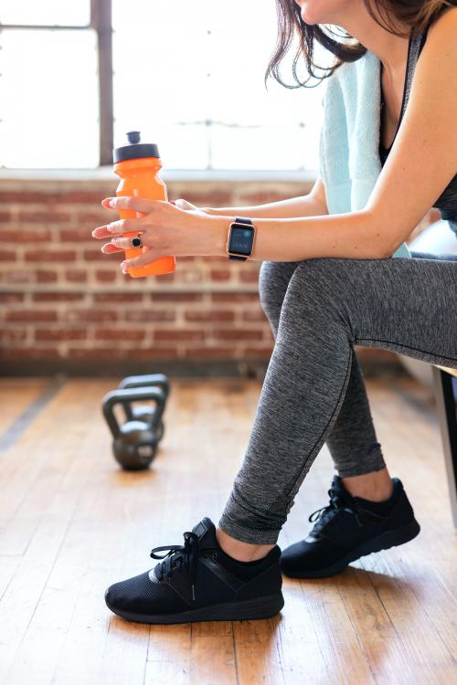 Woman drinking water after workout - 2045791