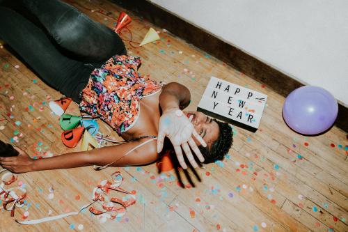 Happy woman on the floor at a party - 2092549