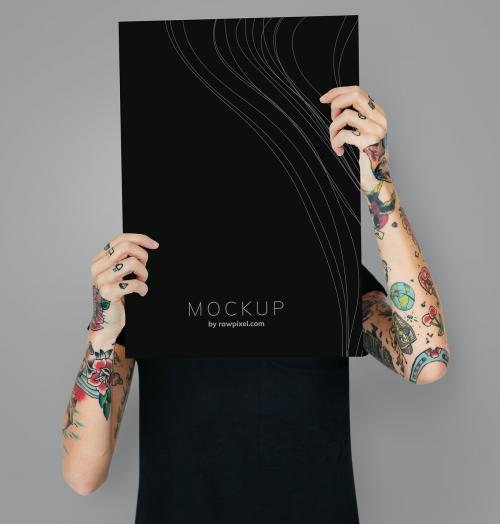Tattooed woman showing blank mockup poster - 503017