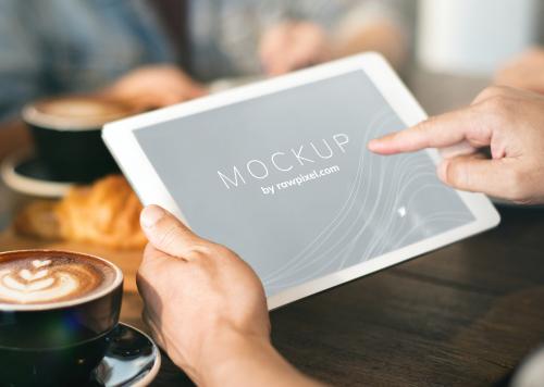 Man working on a tablet with a screen mockup - 503020