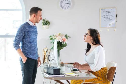 Young businessman talking to a receptionist - 2203481