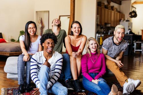 Friends watching a game show on the tv - 2204720