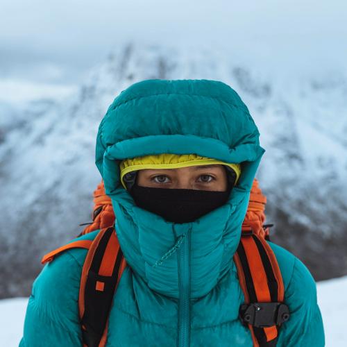 Female mountaineer climbing in wintertime at Glen Coe, Scotland - 2221495