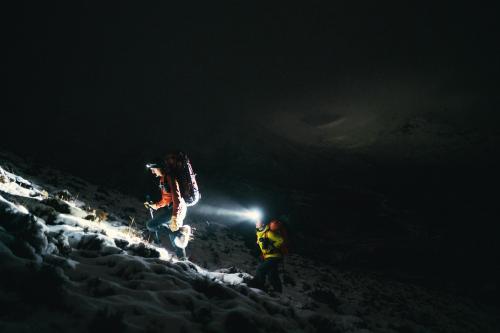 Mountaineers trekking in the cold night at Glen Coe, Scotland - 2221520