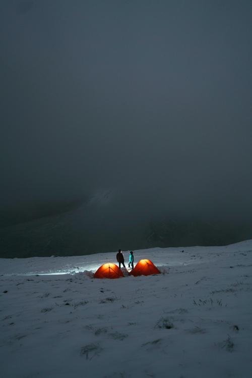 Camping at a misty snowy mountain top - 2221588