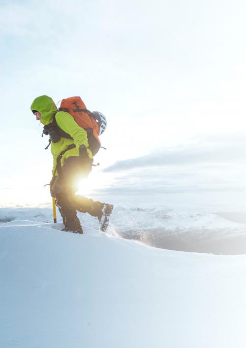 Mountaineer climbing in the snow at Liathach Ridge, Scotland - 2230386