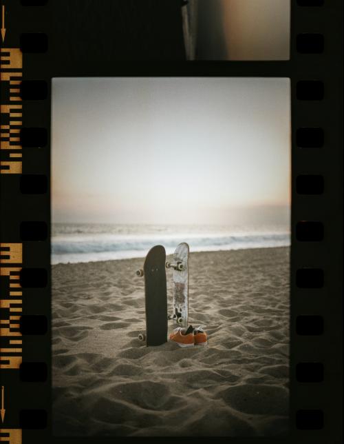 Skateboards at the beach in a film strip - 2268765