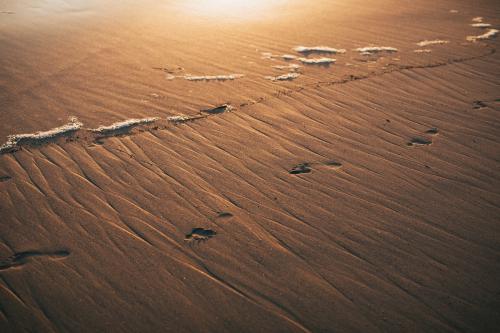 Foot prints at the shore - 2268786