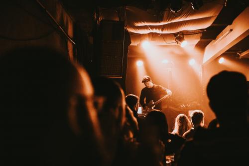 Guitarist playing an electric guitar in a concert - 2271128