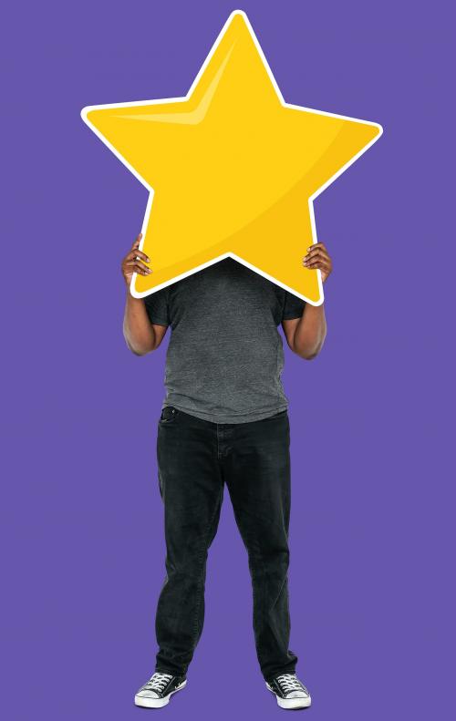 Cheerful man holding a golden star rating symbol - 493320