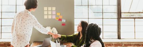 Happy businesswomen doing a handshake social template - 2030470