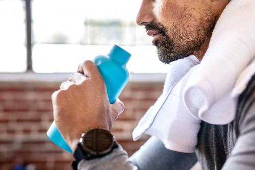 Man drinking water to rehydrate - 2041663