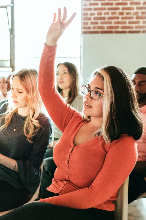 Cheerful woman speaking in a workshop - 2045675