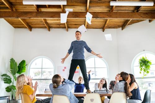 Angry man standing over the table in a meeting - 2204200