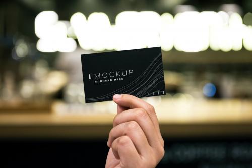 Female hand holding a black business card mockup - 502785