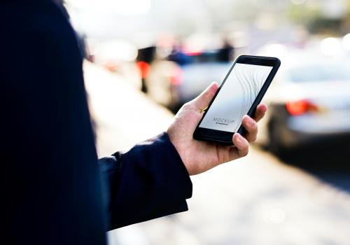 Woman using a smartphone with a screen mockup - 502856