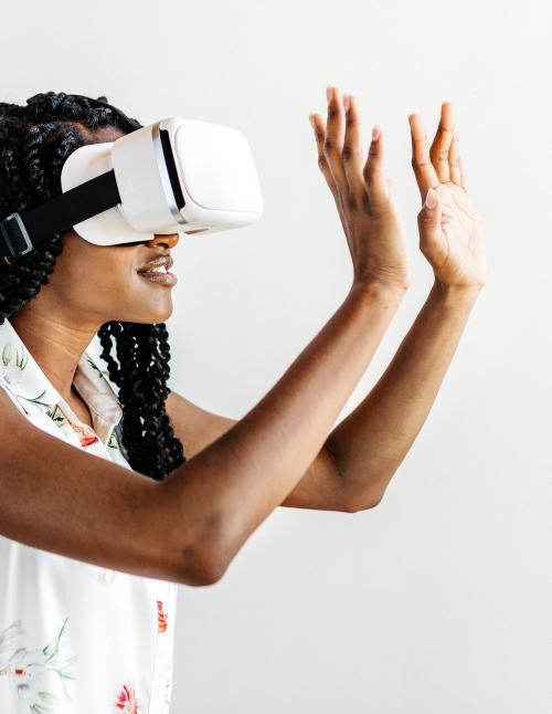 Black woman enjoying a VR headset - 2033356