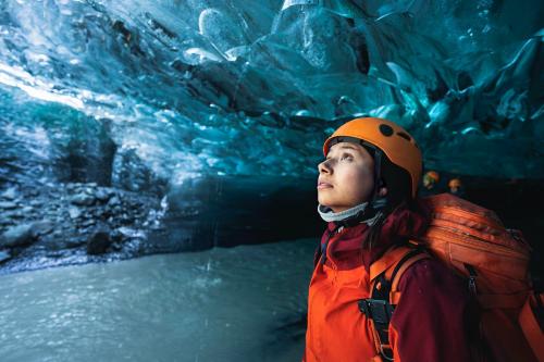 Female explorer in the ice cave, Iceland - 2042851