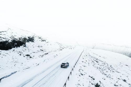 View of a road and fields covered in snow - 2208516