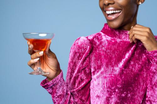 Black woman holding a drink - 2241941