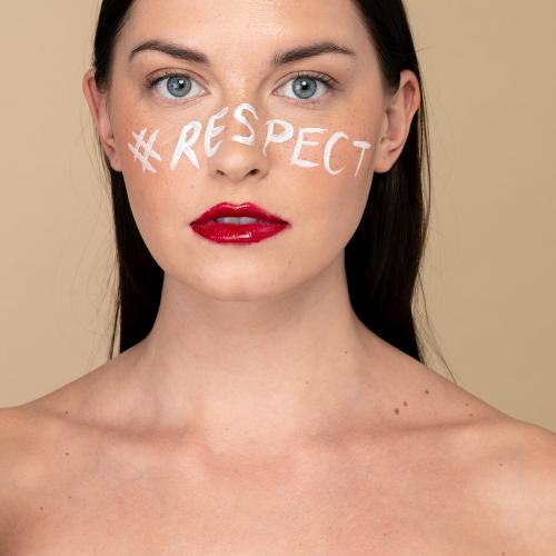 Hashtag respect on a beautiful woman's face - 2250012