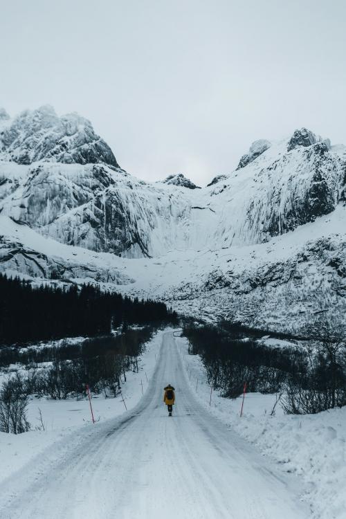 Man standing in the middle of snowy road - 2255753