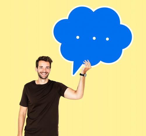 Cheerful man holding a blank speech bubble - 492228