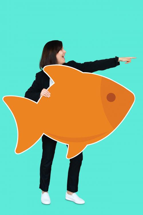 Businesswoman holding a big fish - 492242