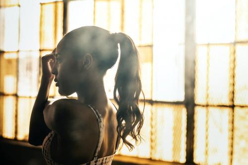 Woman stretching by the windows - 2107468