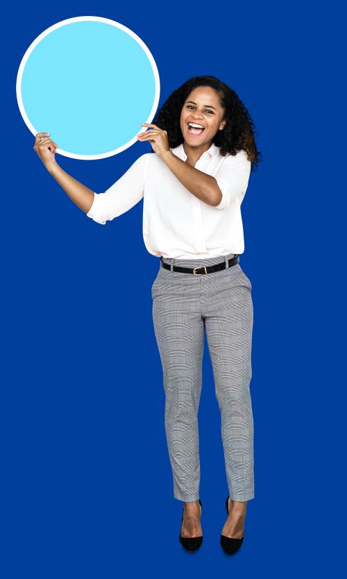 Young businesswoman holding a blank circle - 492456