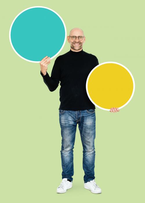 Cheerful man holding a round empty board - 492552