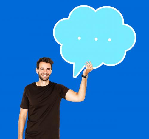 Cheerful man holding a blank speech bubble symbol - 492560