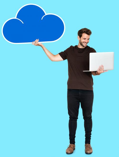 Cheerful man using a laptop and a cloud computing icon - 492608