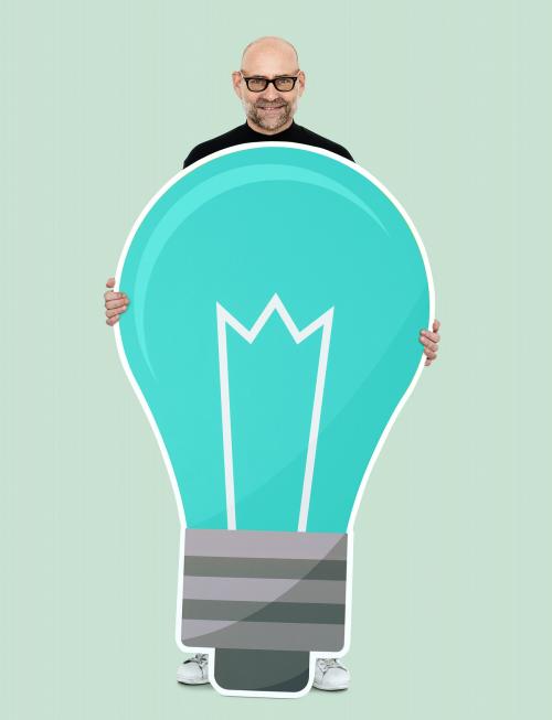 Happy man holding a light bulb icon - 492624